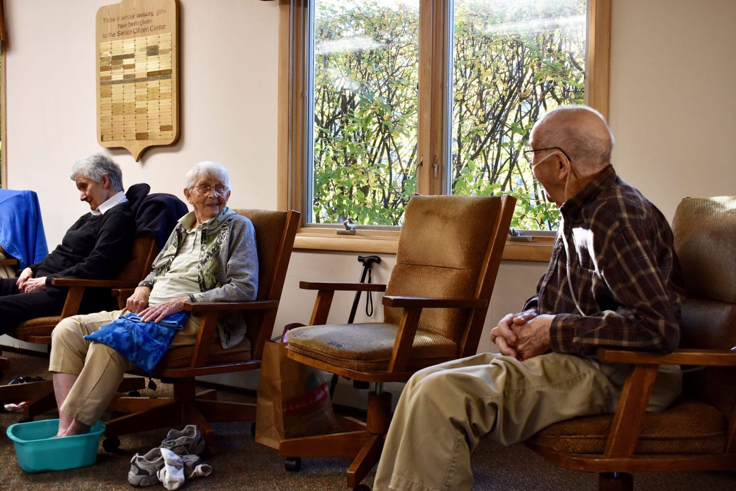 elderly patients talking with one another